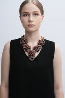 Aidan & Ice Peach Greta necklace featuring a delicate peach-colored pendant on a fine chain.