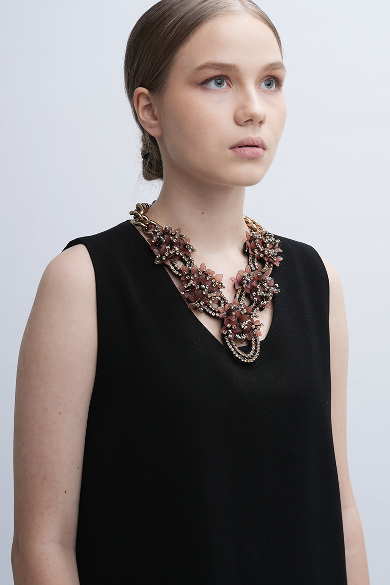 Aidan & Ice Peach Greta necklace featuring a delicate peach pendant on a silver chain, displayed against a neutral background.