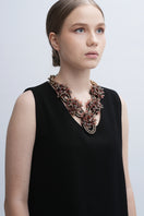 Aidan & Ice Peach Greta necklace featuring a delicate peach pendant on a silver chain, displayed against a neutral background.