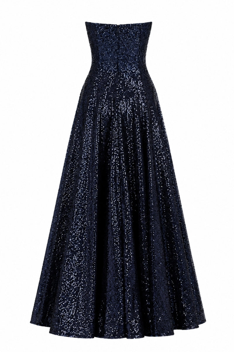 Nihan Peker Vertigo strapless gown in elegant fabric, featuring a fitted bodice and flowing skirt, displayed on a model.