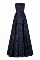 Nihan Peker Vertigo strapless gown in elegant fabric, featuring a fitted bodice and flowing skirt for formal occasions.