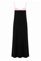 Elegant strapless Siena gown by Nihan Peker, showcasing flowing fabric and sophisticated design on a runway.