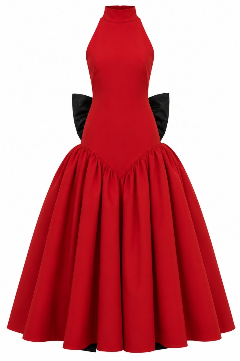 Elegant red gown by Nihan Peker, featuring flowing fabric and sophisticated design, perfect for formal occasions.