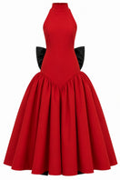 Elegant red gown by Nihan Peker, featuring flowing fabric and sophisticated design, perfect for formal occasions.