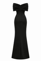 Nihan Peker Ghada black gown featuring elegant fabric and flowing silhouette, shown on a model.