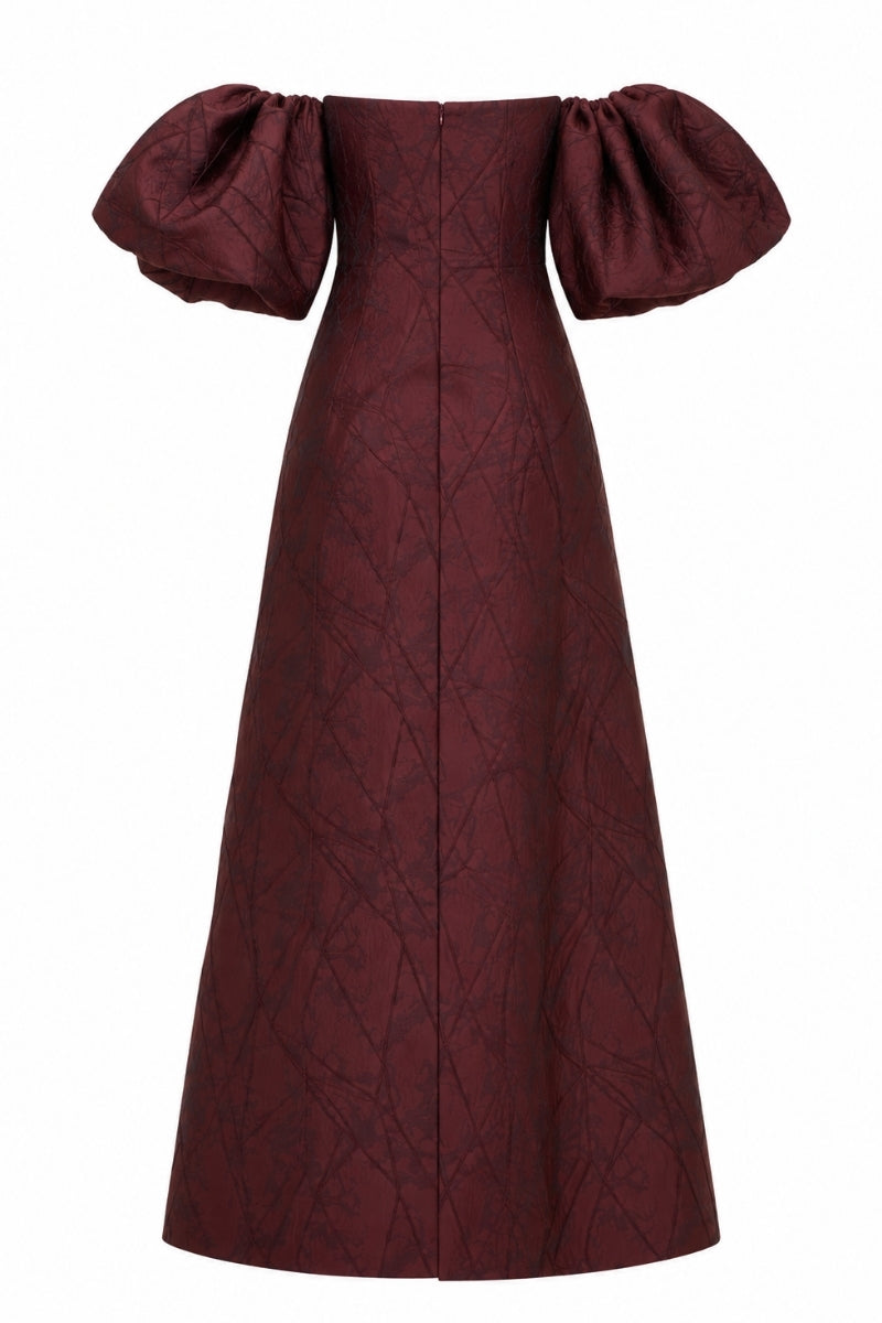 Nihan Peker Mustesna gown, elegant floor-length dress with intricate detailing, showcased on a model.