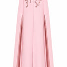 Pink cape gown by Nihan Peker featuring flowing fabric and elegant design, perfect for formal events or fashion shows.