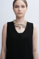 Aidan & Ice Sand Cascade Necklace featuring layered gold chains with sand-inspired pendants and elegant detailing.