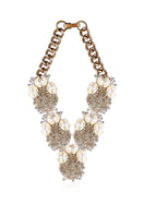 Aidan & Ice Savanna white necklace featuring a delicate chain with a stylish white pendant, displayed against a neutral background.