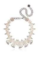 Aidan & Ice Solace white necklace featuring a delicate chain and minimalist pendant on a plain background.