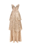 Deep gold V-neck corset gown by Phan Huy with metallic bead embroidery and playful fringe details, shown from the back.