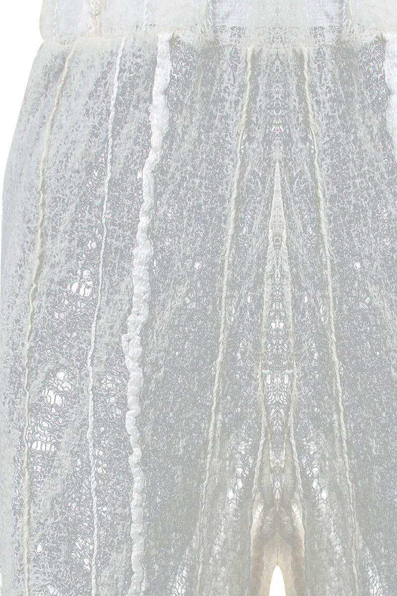NUNO lace culotte trousers by MAZ Manuela Álvarez, stylish wide-leg pants with lace details, shown in a natural fabric finish.