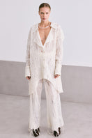 Cream lace culotte trousers by MAZ Manuela Álvarez featuring delicate lace details and wide-leg design.