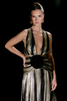 Elegant Nur Karaata Louvre Palace gown with intricate detailing and flowing fabric, showcased in a luxurious evening gown style.
