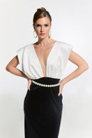 Elegant Nur Karaata Ciragan Palace gown featuring intricate detailing and flowing fabric, perfect for formal occasions.
