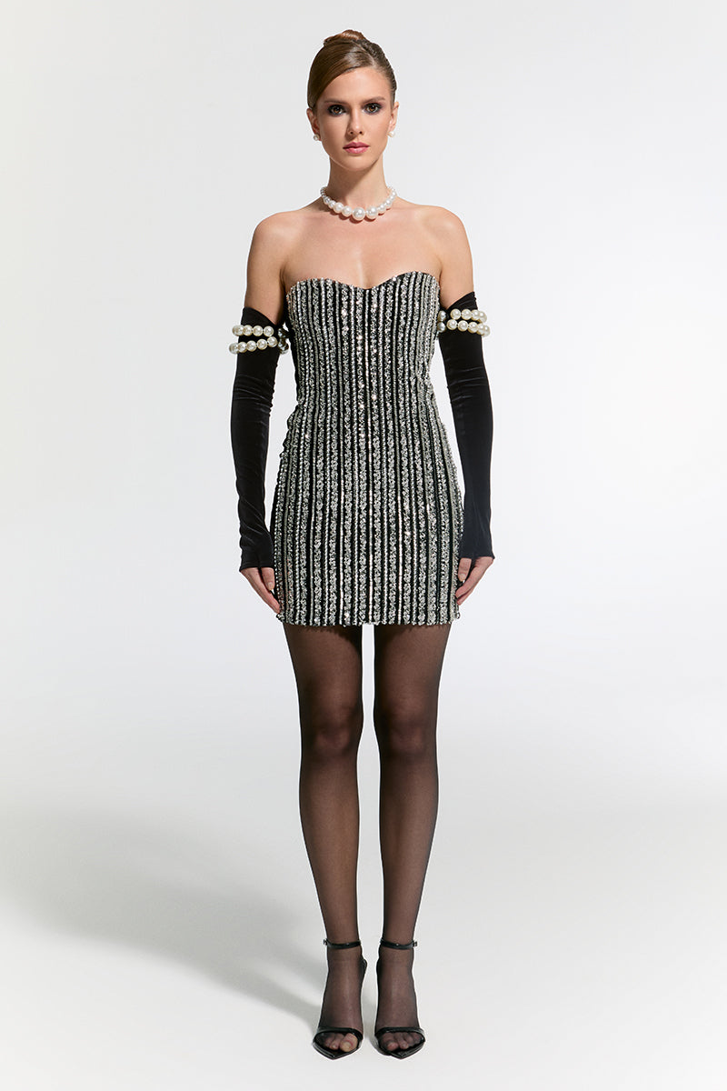 Nur Karaata Schloss Mini Dress shown in black, featuring a fitted silhouette and stylish short sleeves for a chic look.