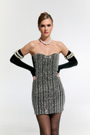 Nur Karaata Schloss Mini Dress, stylish short dress with a modern design, shown in a fashion photo.