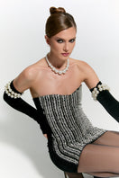 Nur Karaata Schloss mini dress, stylish short dress with intricate details, perfect for fashionable daytime or evening wear.