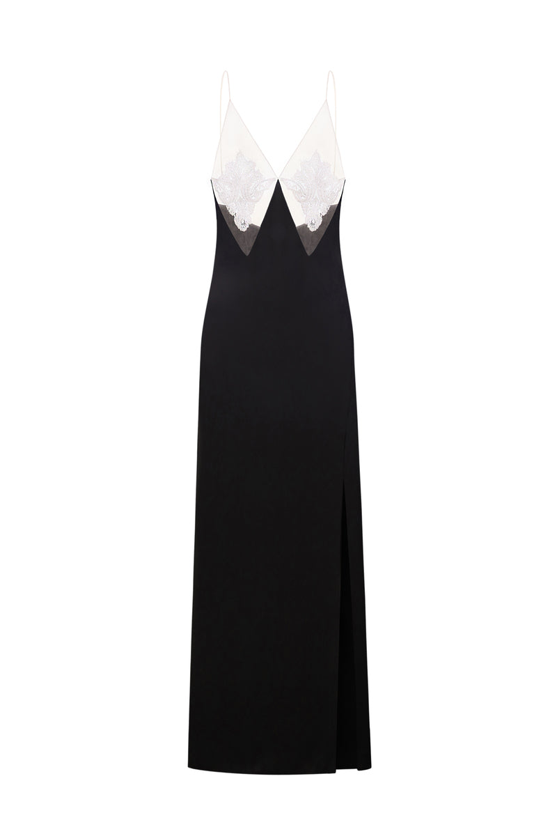 Black Nué Perla maxi dress displayed on a model, featuring elegant flowing fabric and a stylish, sophisticated design.