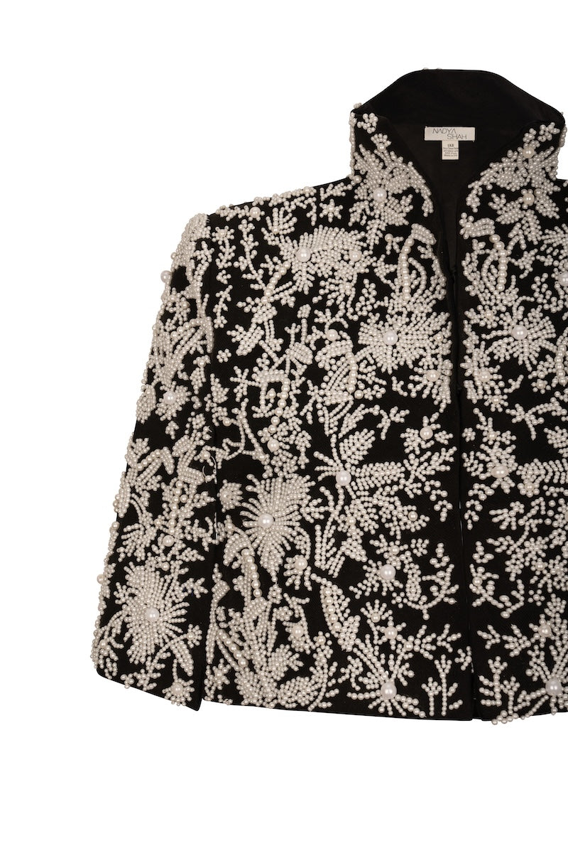 Nadya Shah Cape Anais jacket in soft fabric, featuring a flowing design with elegant draping and detailed stitching.
