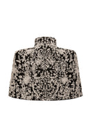 Nadya Shah Cape Anais jacket in elegant fabric, featuring a flowing design with intricate detailing and a stylish collar.