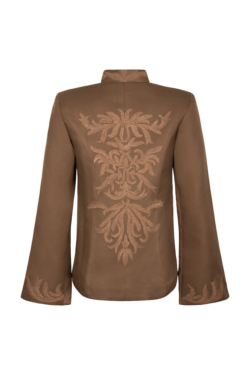 Nadya Shah Odessa jacket displayed on a hanger, showcasing its stylish design and fabric details.