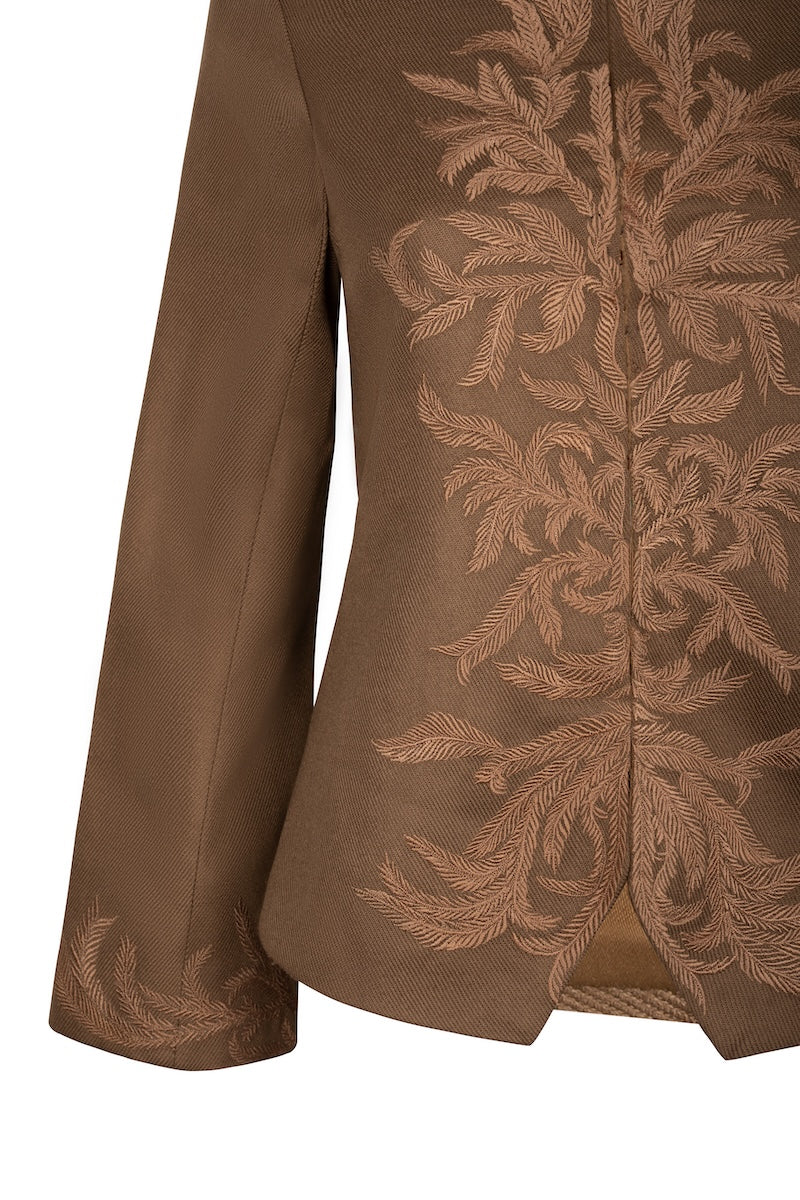 Nadya Shah Odessa jacket featuring a stylish, tailored design with a zip front and collar, displayed on a hanger.