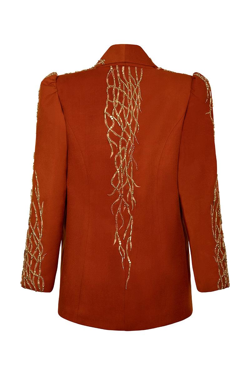 Nadya Shah Artemis jacket, stylish outdoor jacket with a fitted design, in a neutral color, displayed on a hanger.