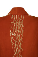 Nadya Shah Artemis jacket displayed on a hanger, showcasing its stylish design and fabric texture.