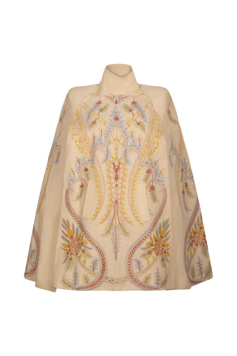 Ivory Dorian cape jacket by Nadya Shah, showcasing elegant fabric and stylish design, perfect for sophisticated outerwear.