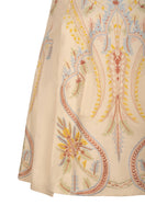 Ivory Dorian Cape jacket by Nadya Shah, featuring elegant draped fabric and stylish design, displayed on a mannequin.