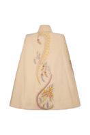 Ivory DORIAN cape jacket by Nadya Shah, featuring elegant fabric and stylish design, displayed on a model.