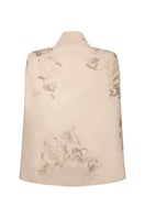 Nadya Shah Lumiere Cape jacket in elegant fabric, displayed on a hanger with intricate detailing and stylish design.