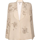 Nadya Shah Lumiere Cape jacket featuring elegant fabric and stylish design, displayed on a hanger with a neutral background.