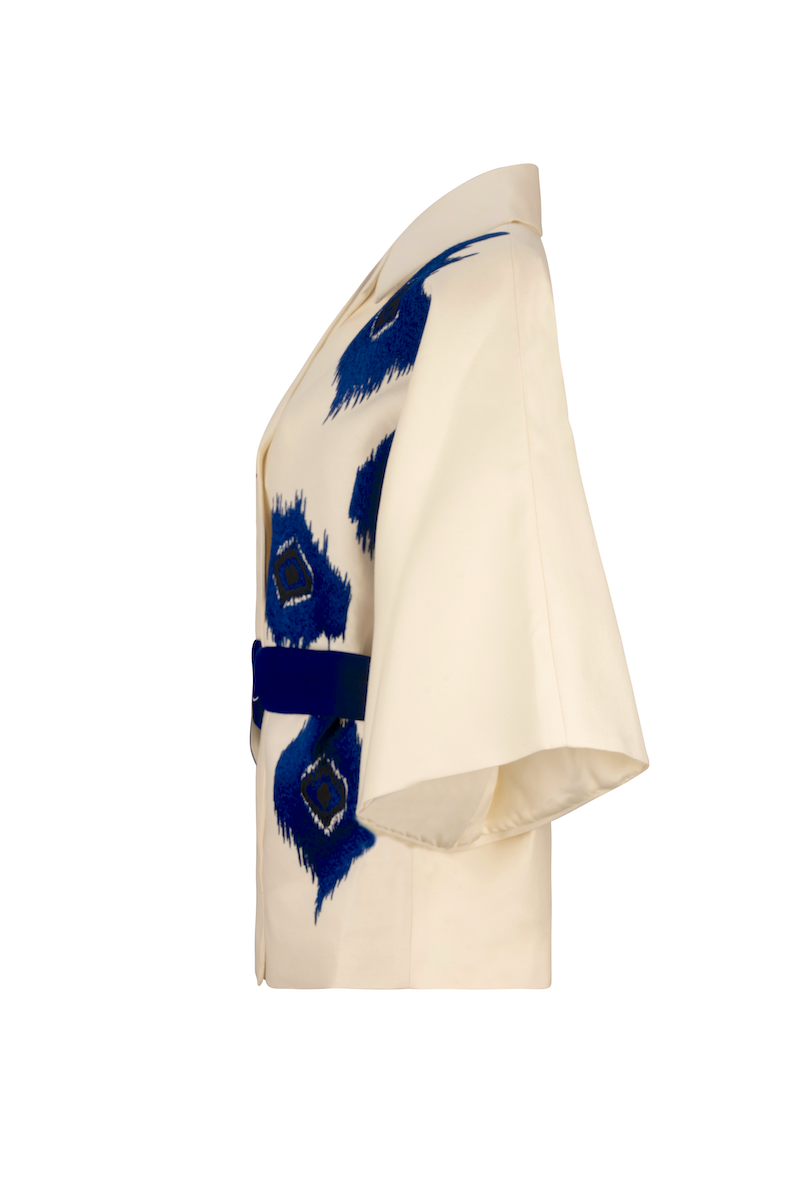 Nadya Shah TYCHEE blue jacket with stylish design, fitted silhouette, and front zipper, displayed on a mannequin.