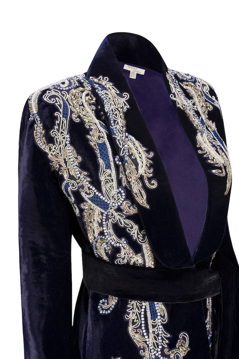 Manal midnight blue velvet smoking jacket by Nadya Shah, featuring luxurious fabric and classic design, displayed on a hanger.