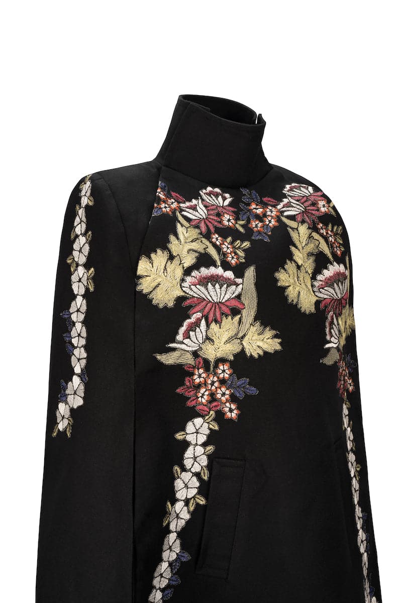 Black Wisteria cape jacket by Nadya Shah, featuring elegant draping and detailed floral-inspired design.