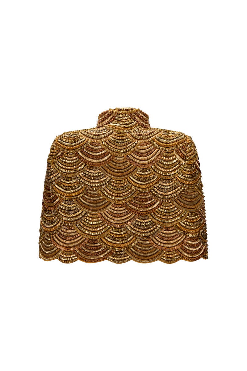 Nadya Shah Gilt De Havilland Cape jacket in luxurious fabric, featuring elegant design and detailed craftsmanship.