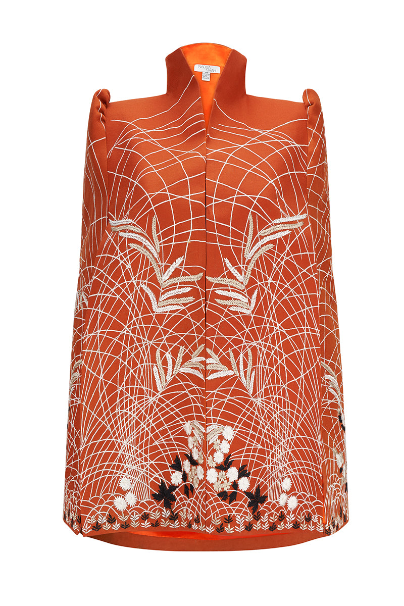 Nadya Shah Clementine cape jacket in vibrant orange with open front and wide collar, stylish outerwear for fall and winter.
