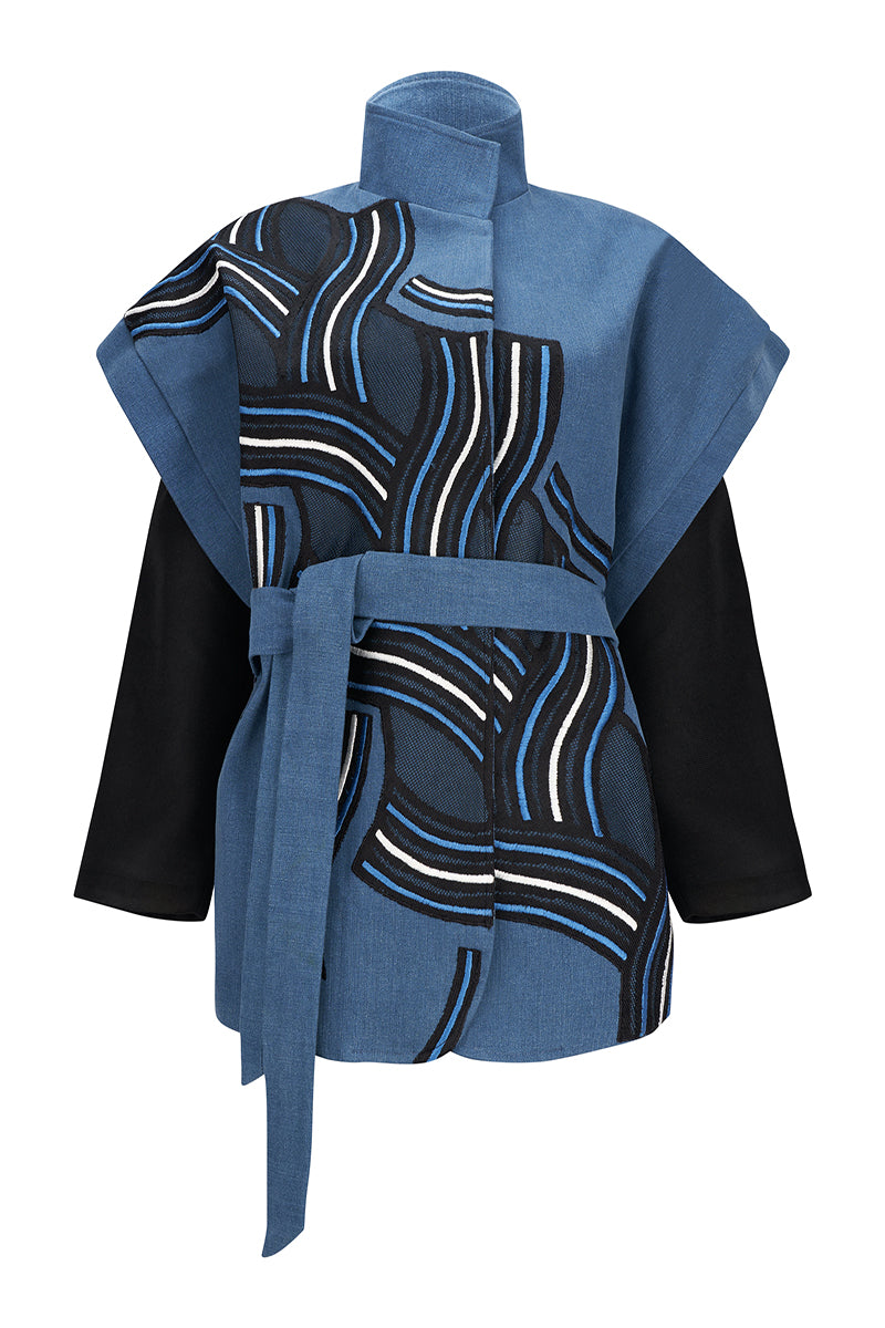 Nadya Shah twist denim jacket with classic design, featuring a button-front and stylish fit, shown on a model.