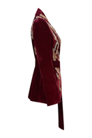 Nadya Shah men's brown smoking jacket with satin lapels, tailored fit, and luxurious fabric, displayed on a hanger.