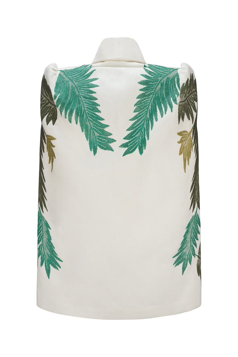 Nadya Shah Cara Leaf Cape jacket featuring a vibrant leaf pattern, stylish long sleeves, and a flowing silhouette.