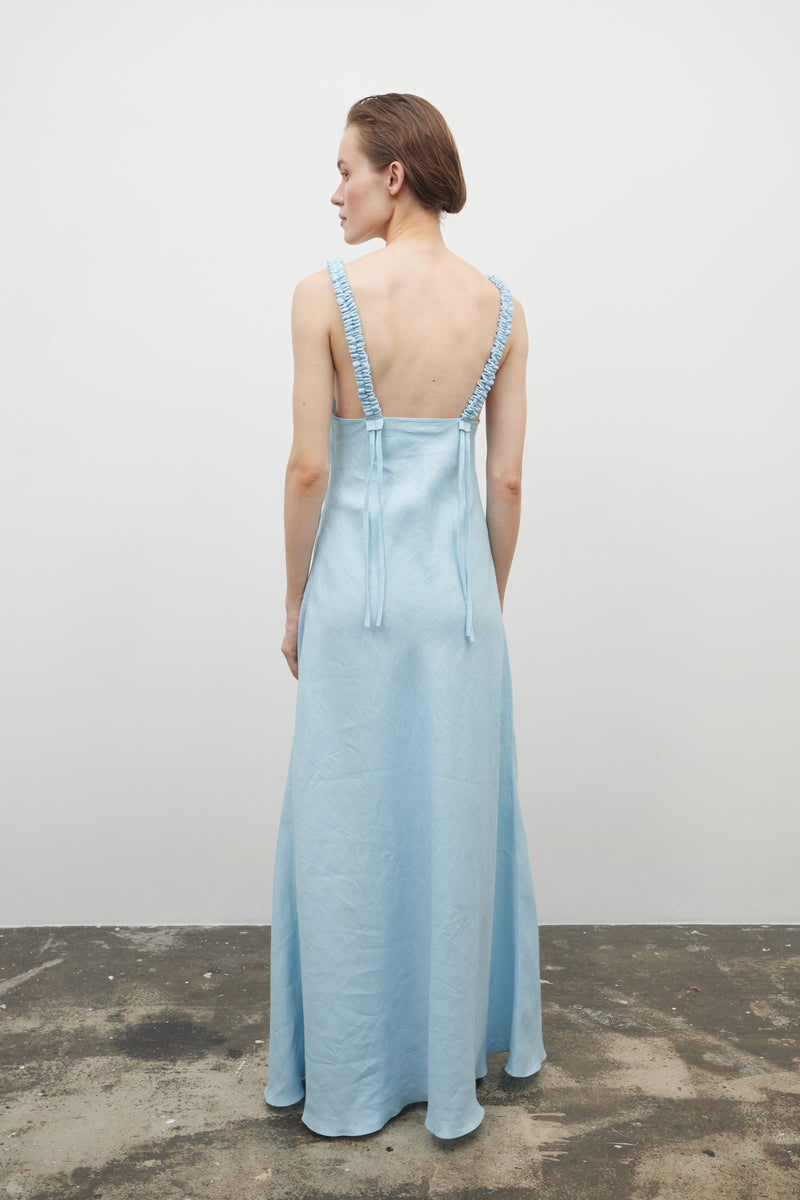 Baby blue NATIA maxi dress by Tamar Keburia with flowing fabric and elegant design, perfect for stylish summer wear.