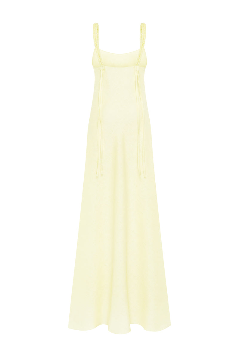 Yellow NATIA maxi dress by Tamar Keburia featuring a flowing design and vibrant lemon color, perfect for summer wear.
