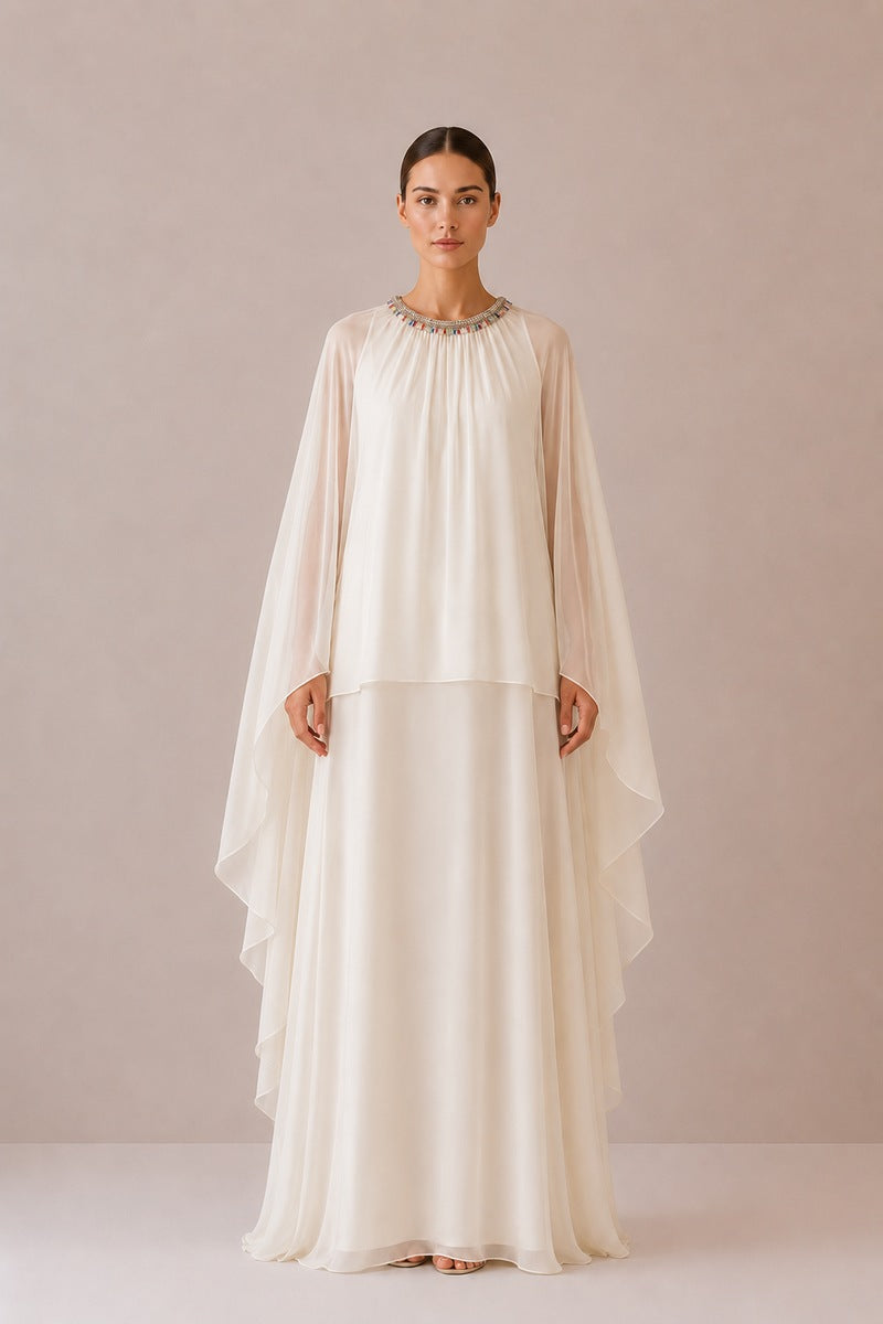 Nihan Peker Nazz Vanilla gown, elegant dress with flowing fabric and minimalist design, displayed on a mannequin.