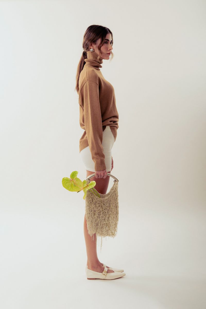 White Neus crochet shoulder bag by Millanne Tale, stylish and crafted handbag with a woven design and shoulder strap.