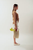 White Neus crochet shoulder bag by Millanne Tale featuring a stylish, textured design and a comfortable shoulder strap.