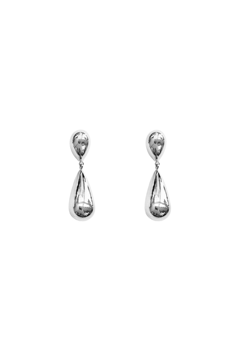 Silver toned earrings by Aethera featuring a sleek, modern design with intricate detailing, perfect for stylish accessorizing.