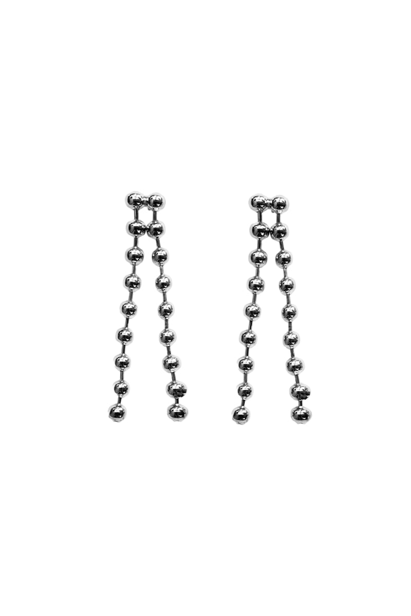 A pair of sleek MAJA earrings by Aethera featuring modern geometric design in shiny metal.
