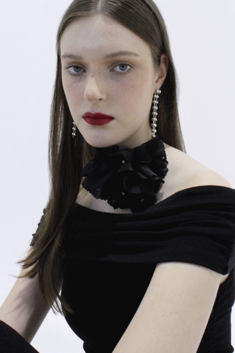 A pair of elegant MAJA Earrings by Aethera featuring sleek, modern design with polished metal finish on a plain background.